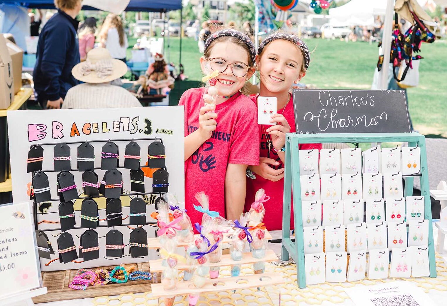 Young entrepreneurs running a bracelet booth